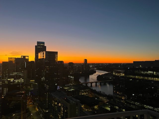 property's view of city featuring a water view