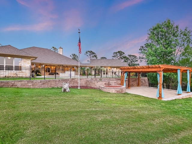 yard at dusk with a patio area