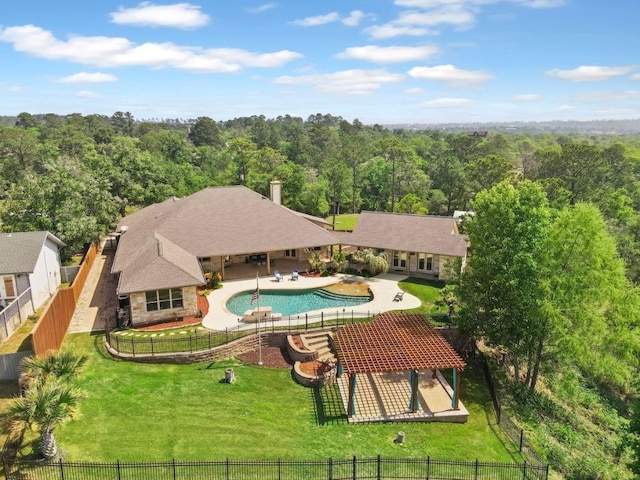 view of pool featuring a patio and a yard