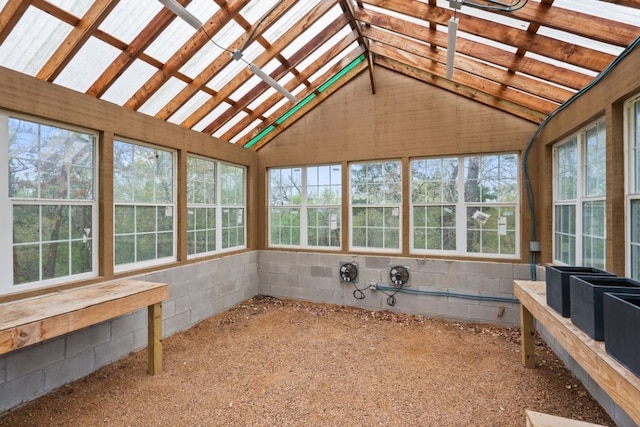 unfurnished sunroom featuring a healthy amount of sunlight and vaulted ceiling