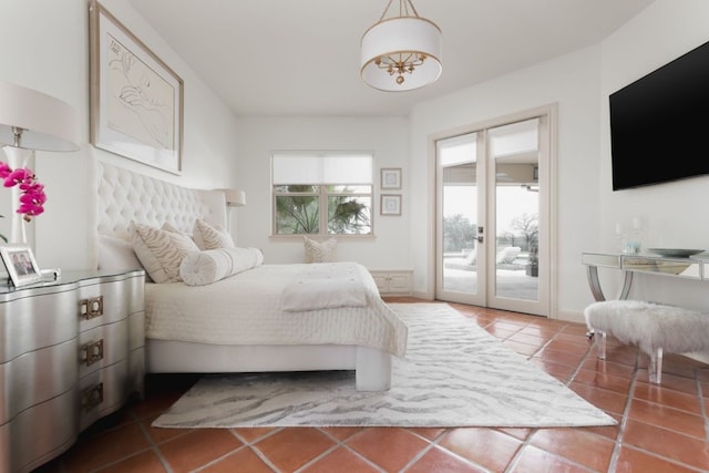 tiled bedroom featuring access to exterior