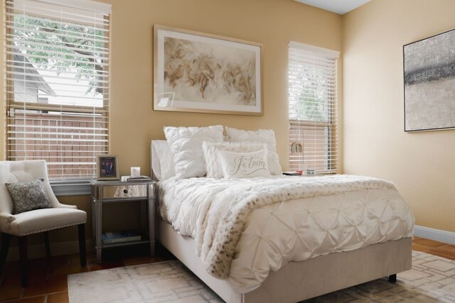 bedroom featuring baseboards