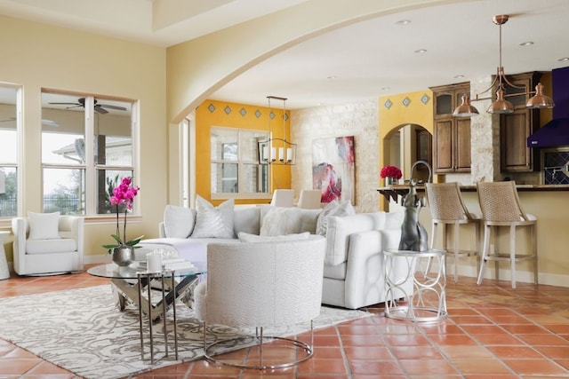 tiled living room with ceiling fan