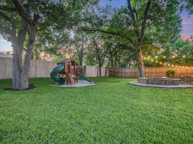 yard at dusk with a playground