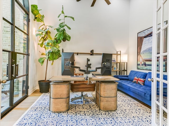 interior space featuring light hardwood / wood-style flooring, french doors, plenty of natural light, and ceiling fan