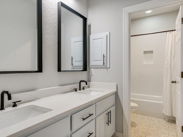 full bathroom with toilet, tile patterned flooring, vanity, and shower / tub combo