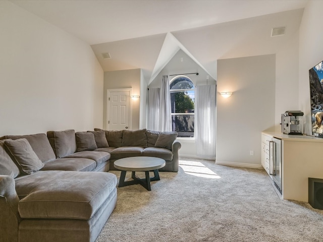 living room with light carpet, lofted ceiling, and wine cooler