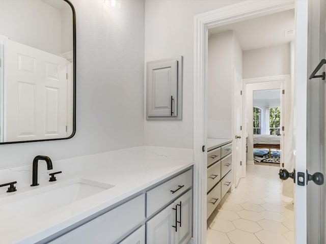 bathroom with vanity and tile patterned flooring