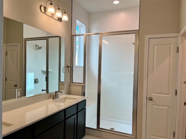 bathroom featuring vanity and walk in shower