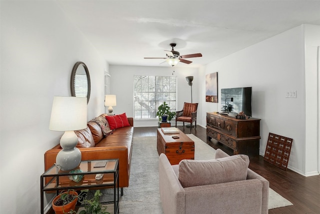 living room with dark hardwood / wood-style floors and ceiling fan