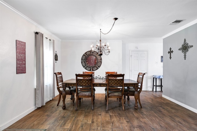 dining room featuring crown molding, a notable chandelier, and dark hardwood / wood-style flooring