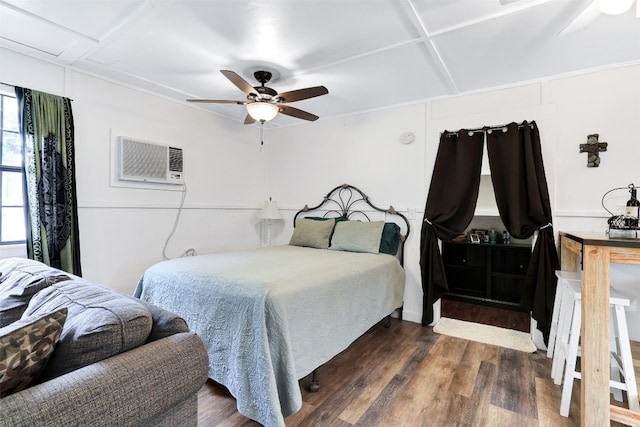 bedroom featuring a wall mounted AC, dark hardwood / wood-style floors, and ceiling fan