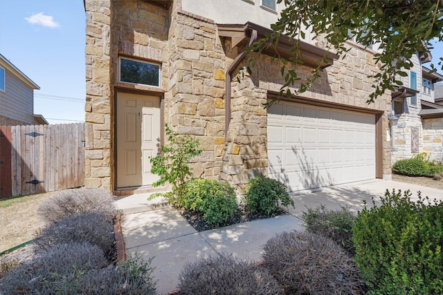 doorway to property featuring a garage