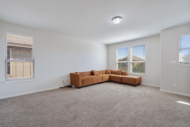 unfurnished living room featuring carpet