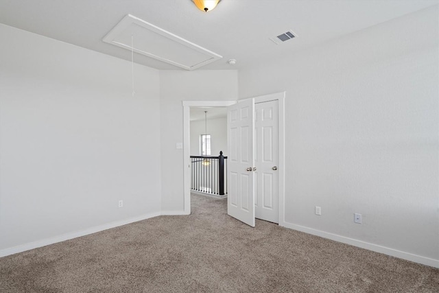 16304 Travesia Way, Austin, TX 78728 - carpeted empty room with attic access and baseboards