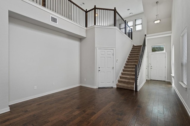 16304 Travesia Way, Austin, TX 78728 - foyer entrance featuring a towering ceiling, stairs, and dark wood finished floors