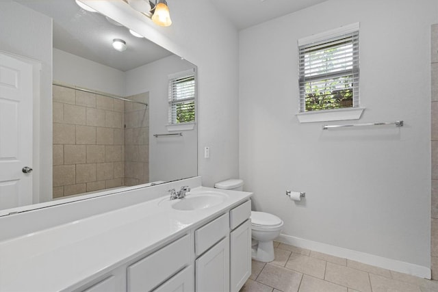 16304 Travesia Way, Austin, TX 78728 - bathroom featuring healthy amount of natural light, tiled shower, vanity, and tile patterned floors
