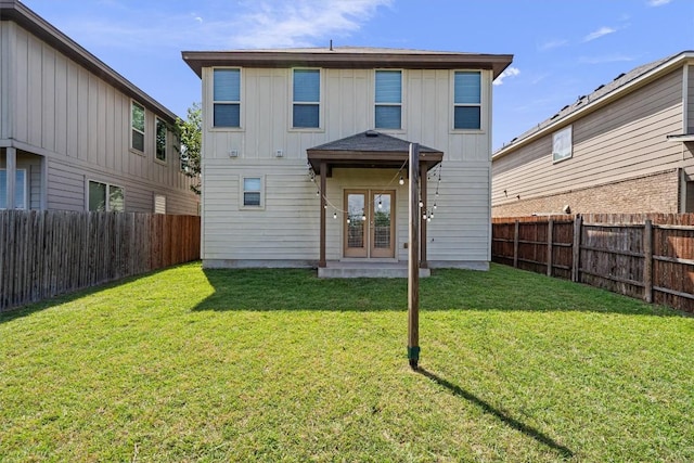 16304 Travesia Way, Austin, TX 78728 - back of property with french doors, a fenced backyard, and board and batten siding
