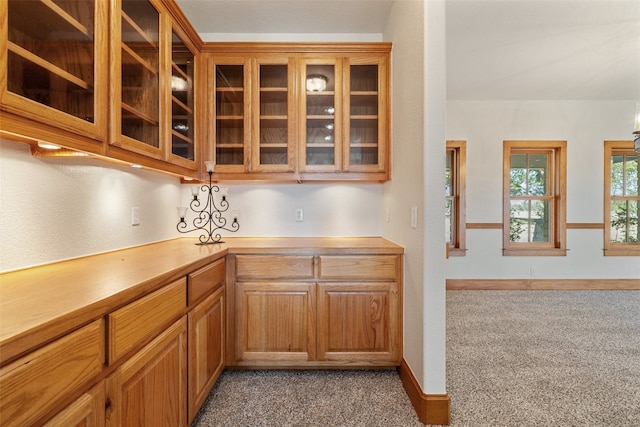 kitchen featuring light colored carpet