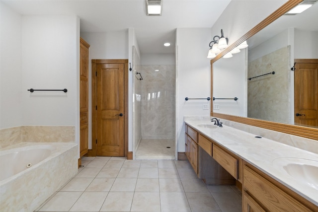 bathroom with tile patterned floors, vanity, and independent shower and bath