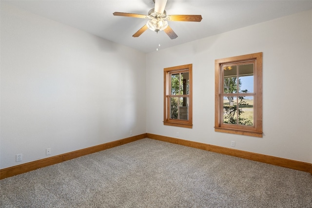 unfurnished room with ceiling fan and carpet floors