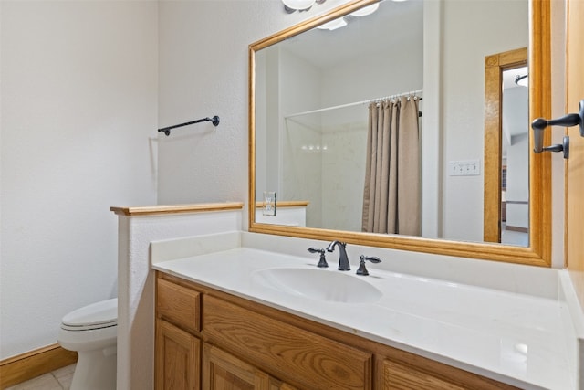 bathroom featuring a shower with curtain, vanity, toilet, and tile patterned flooring