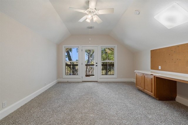 additional living space featuring light carpet, vaulted ceiling, and ceiling fan