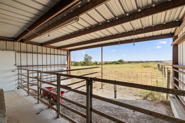 view of stable with a rural view