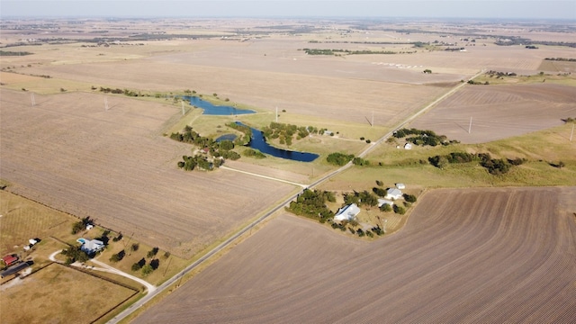 drone / aerial view with a rural view and a water view