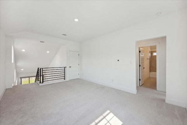 unfurnished room with light carpet