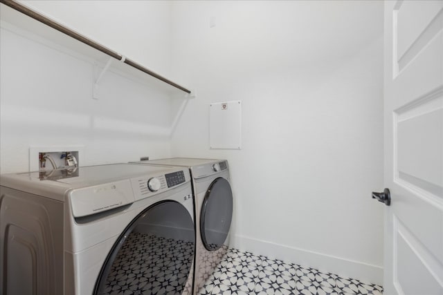 laundry area with independent washer and dryer