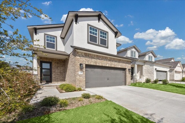 1325 Kneehigh Dr, Georgetown, TX 78633 - view of front of house featuring driveway, stucco siding, an attached garage, and stone siding