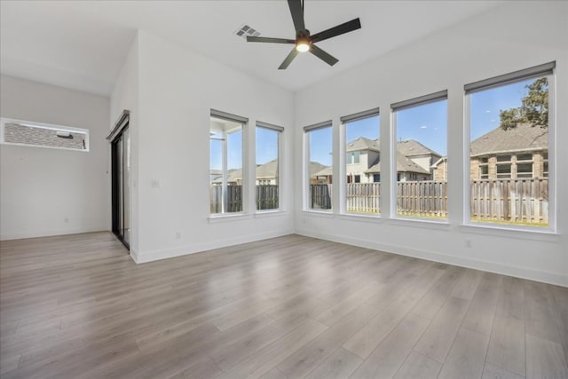 spare room with ceiling fan and light hardwood / wood-style flooring