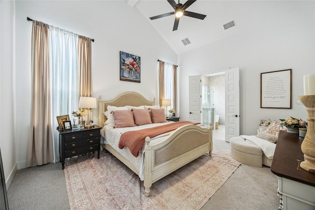 1325 Kneehigh Dr, Georgetown, TX 78633 - bedroom featuring light colored carpet, high vaulted ceiling, ensuite bath, beamed ceiling, and a ceiling fan
