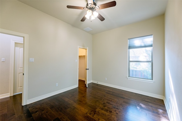 empty room featuring dark hardwood / wood-style floors and ceiling fan