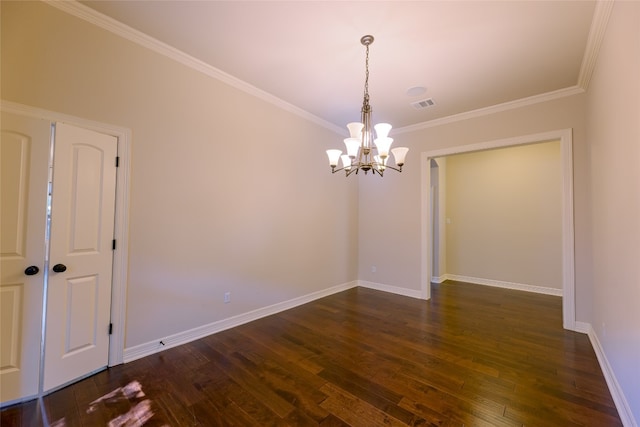 empty room featuring ornamental molding, an inviting chandelier, and dark hardwood / wood-style flooring