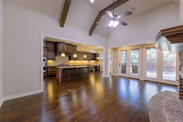 living room featuring beamed ceiling, dark wood-type flooring, sink, high vaulted ceiling, and ceiling fan