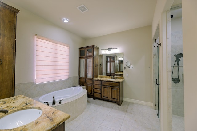 bathroom with vanity, shower with separate bathtub, and tile patterned floors