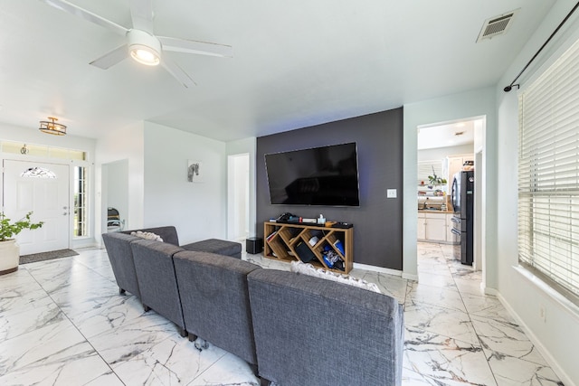 living room featuring ceiling fan