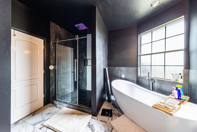 bathroom with a textured ceiling and plus walk in shower