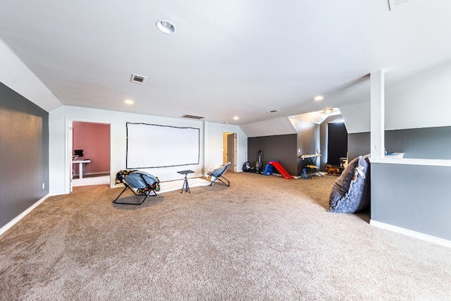 game room with vaulted ceiling and carpet floors