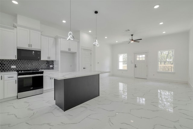 kitchen featuring a kitchen island, pendant lighting, white cabinetry, and stainless steel appliances