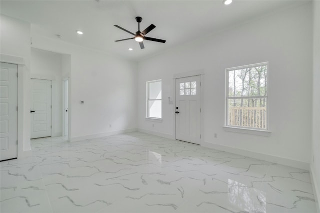 entrance foyer with ceiling fan