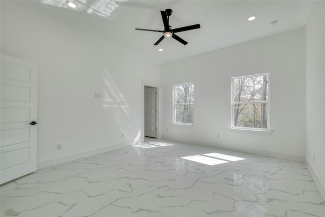 unfurnished room with ceiling fan