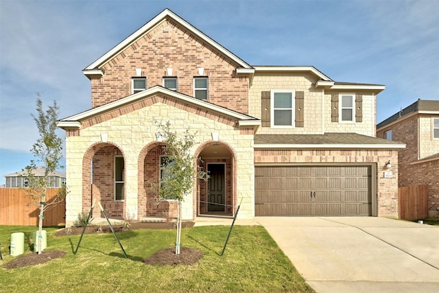 view of front facade with a garage and a front lawn