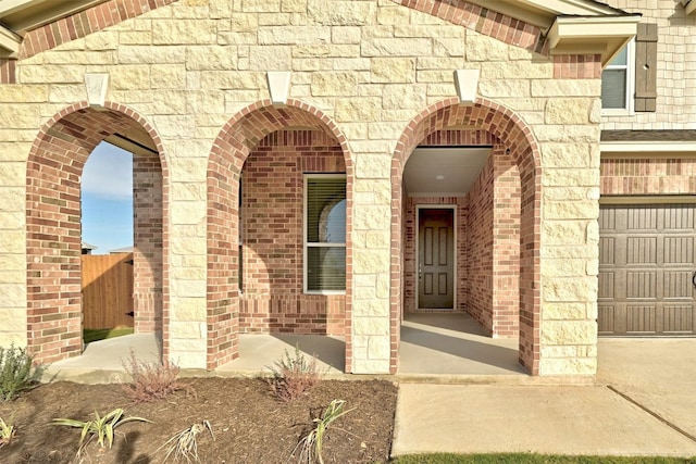 entrance to property featuring a garage