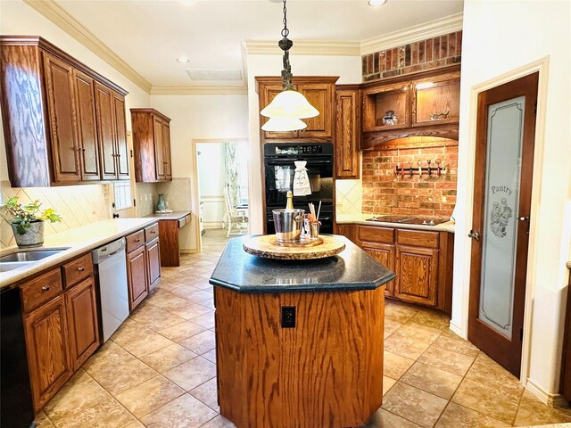 kitchen featuring ornamental molding, black appliances, tasteful backsplash, and a kitchen island