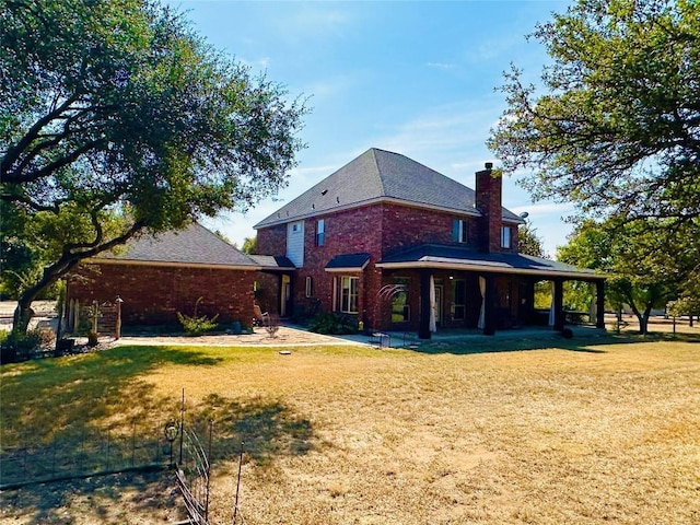 300 Copper Ln, Leander, TX 78641 - rear view of property with a chimney, a lawn, and brick siding