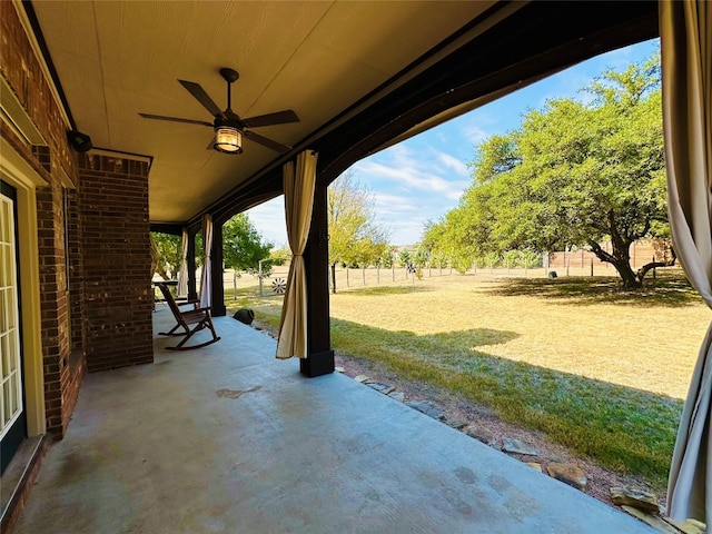 view of patio featuring ceiling fan