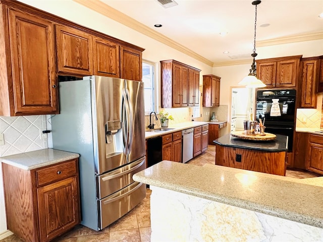 kitchen with sink, stainless steel appliances, a center island, and decorative backsplash